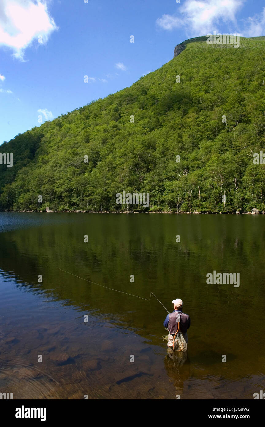 A fly fisherman at Old Mountain in the Mountain Plaza in Franconia.  The Old Man in the Mountain Stock Photo