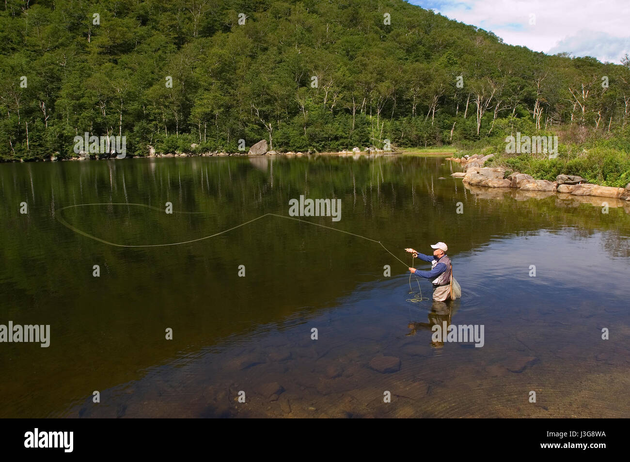 A fly fisherman at Old Mountain in the Mountain Plaza in Franconia, New Hampshire, USA Stock Photo