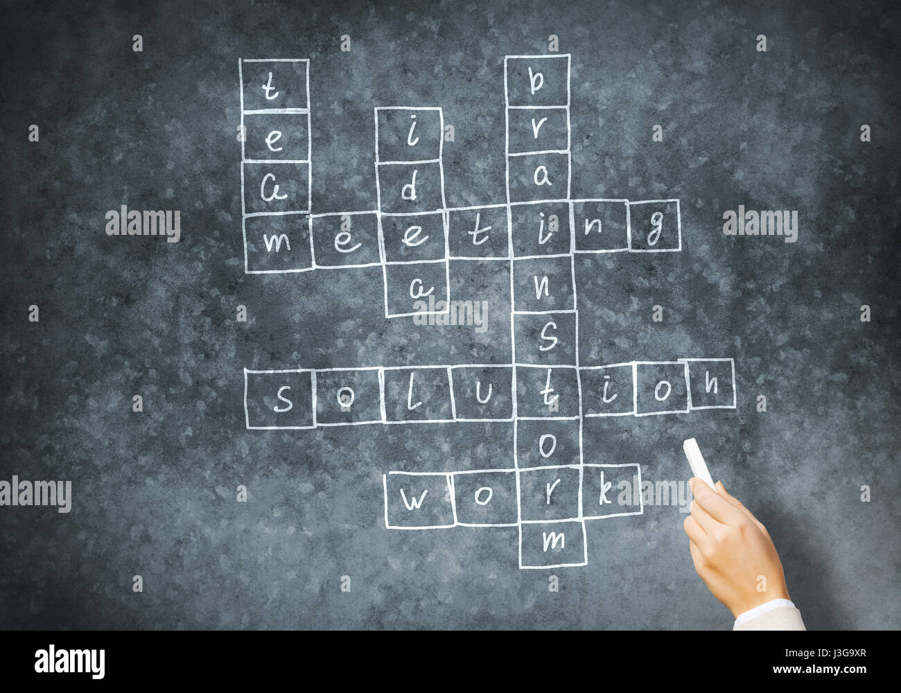 Woman draw crossword Stock Photo Alamy
