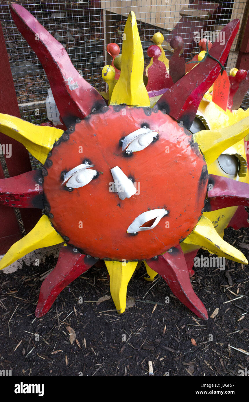 Decorative metal sun face lawn ornament. St Paul Minnesota MN USA Stock Photo