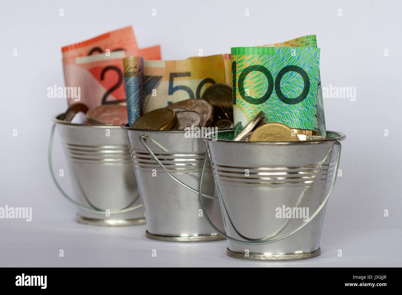 Three buckets of Australian money Stock Photo Alamy