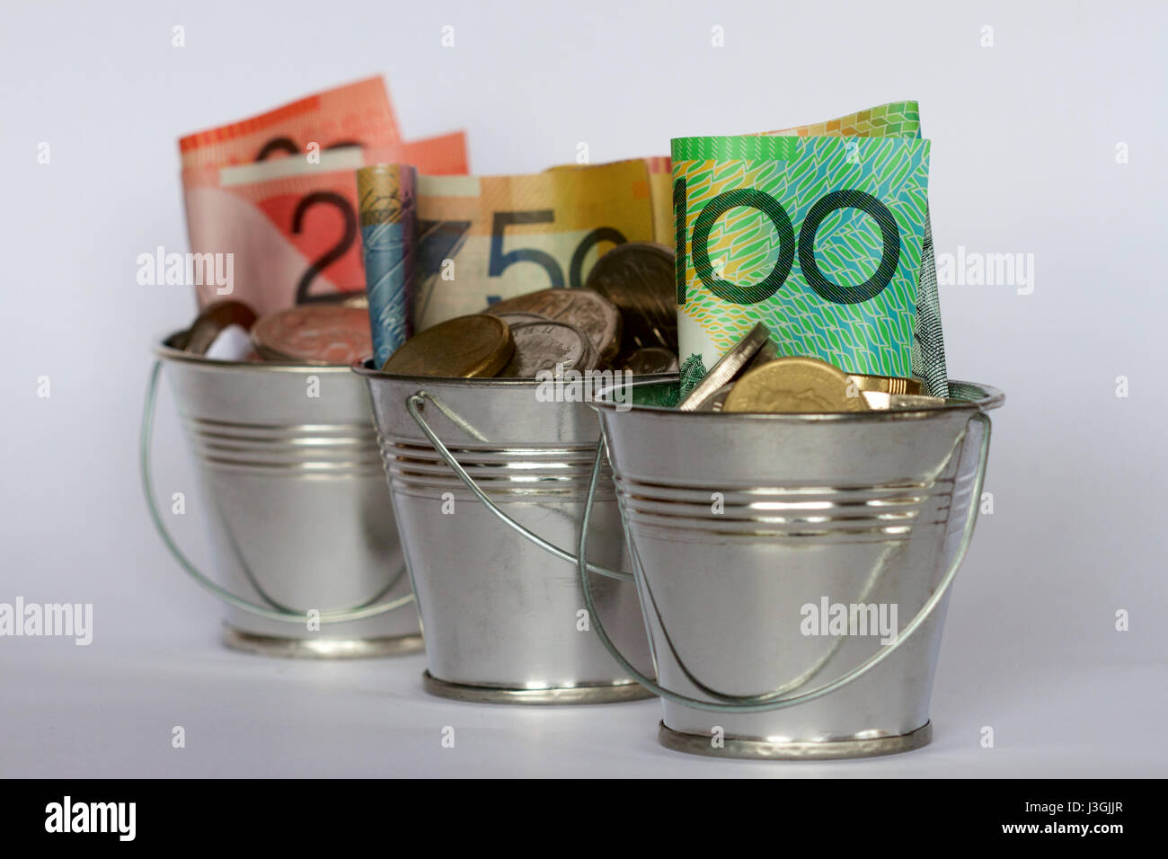 Three buckets of Australian money. Stock Photo