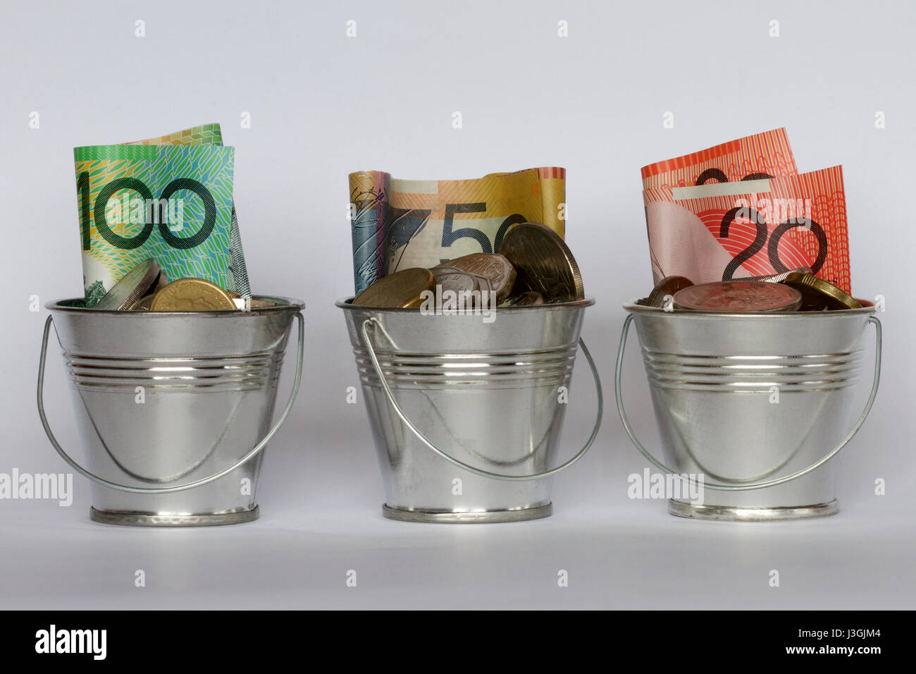 Three buckets of Australian money. Stock Photo