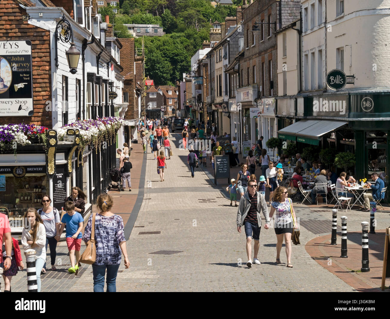 Busy pedestrianised Cliffe High Street with shops and shoppers on a sunny day in Summer, Lewes, East Sussex, England, UK Stock Photo