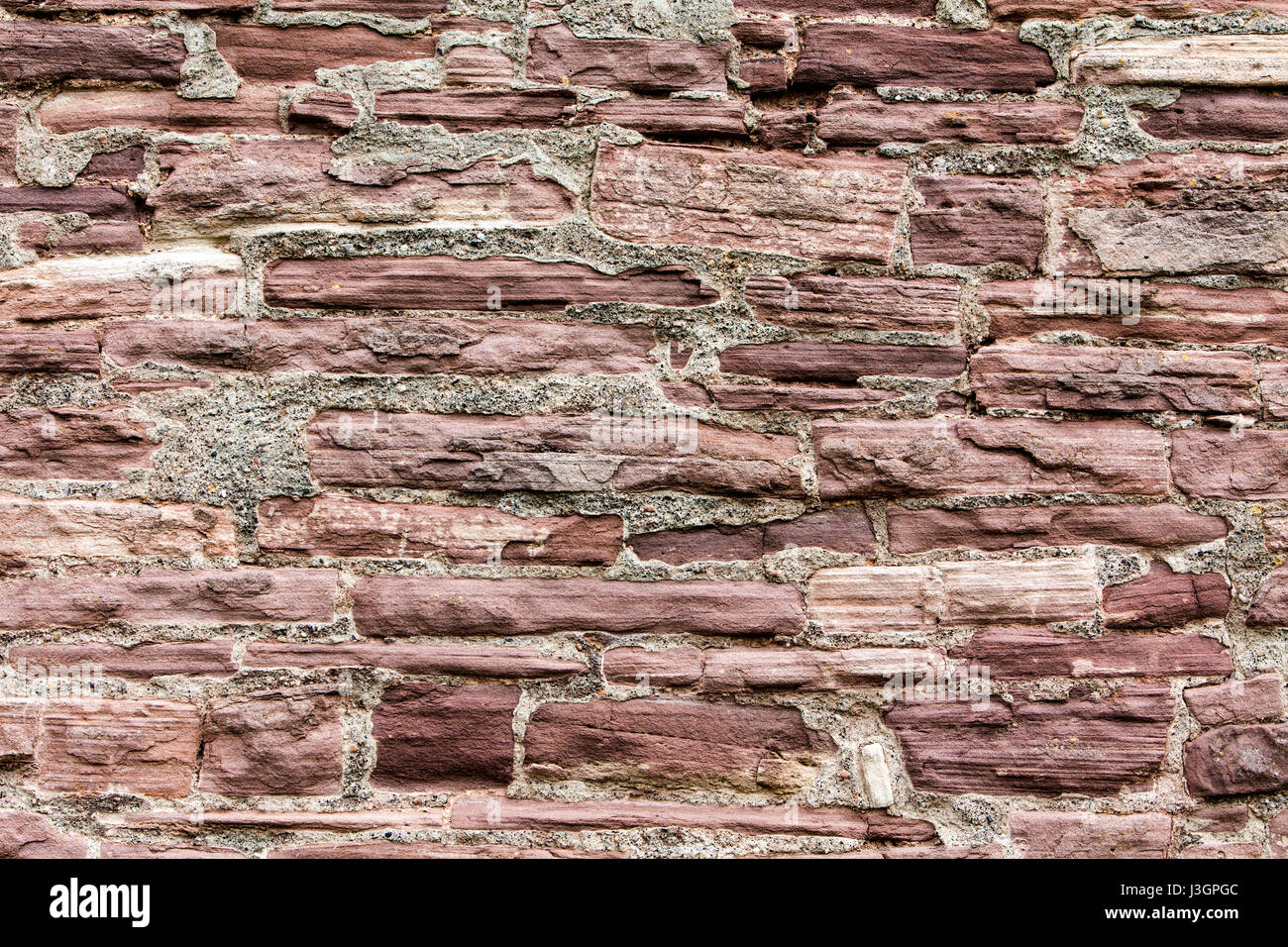 Old walls built with red sandstone from the Weserbergland, Krukenburg Castle, Helmarshausen, Bad Karlshafen, Hesse, Germany, Europe Stock Photo