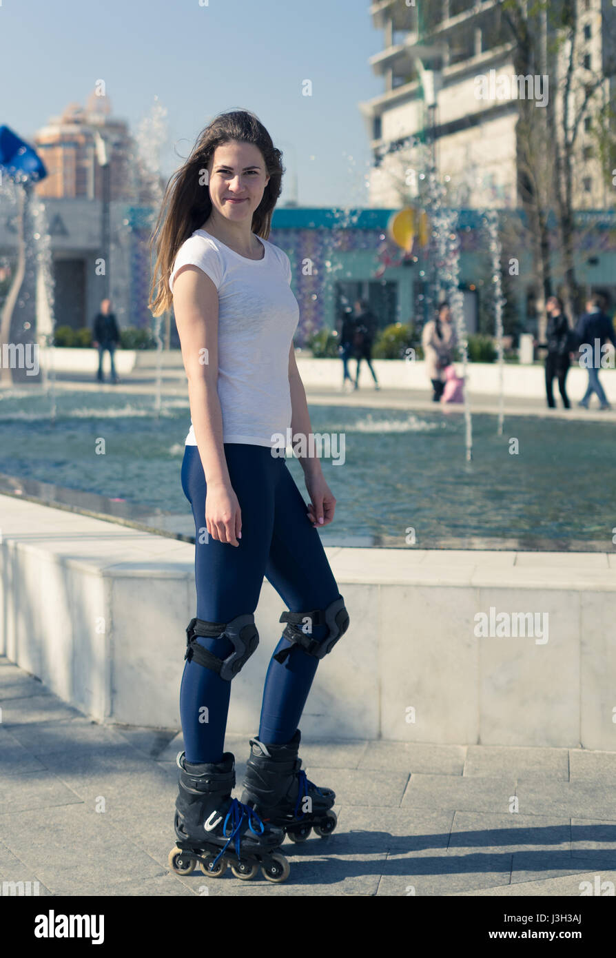 happy Roller Girl skating in the park Stock Photo