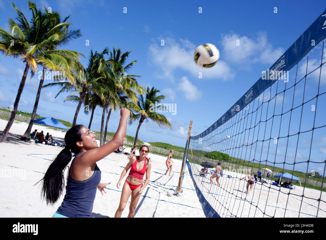 Miami Beach Florida,Lummus Park,beach volleyball competition,woman female women,sand,net,ball,sport,athlete,fitness,sun exposure,FL080913104 Stock Photo