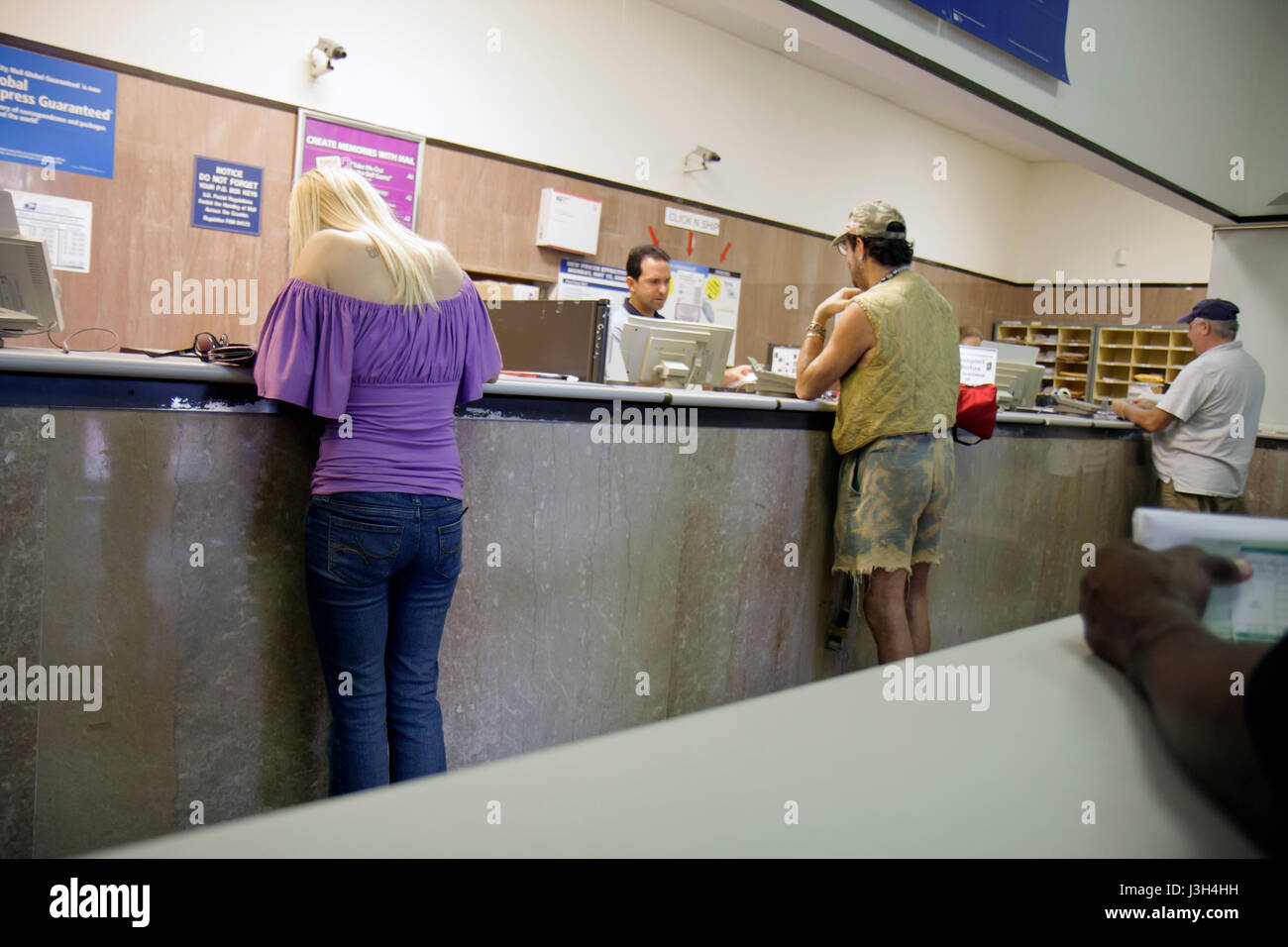 Miami Beach Florida,Washington Avenue,USPS,United States Postal Service,post office postal service,counter,servers employee employees worker workers w Stock Photo