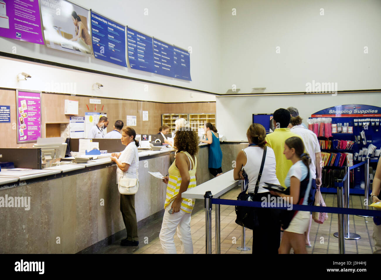Miami Beach Florida,USPS United States Postal Service post office inside interior,counter customers US mail line queue wait waiting, Stock Photo
