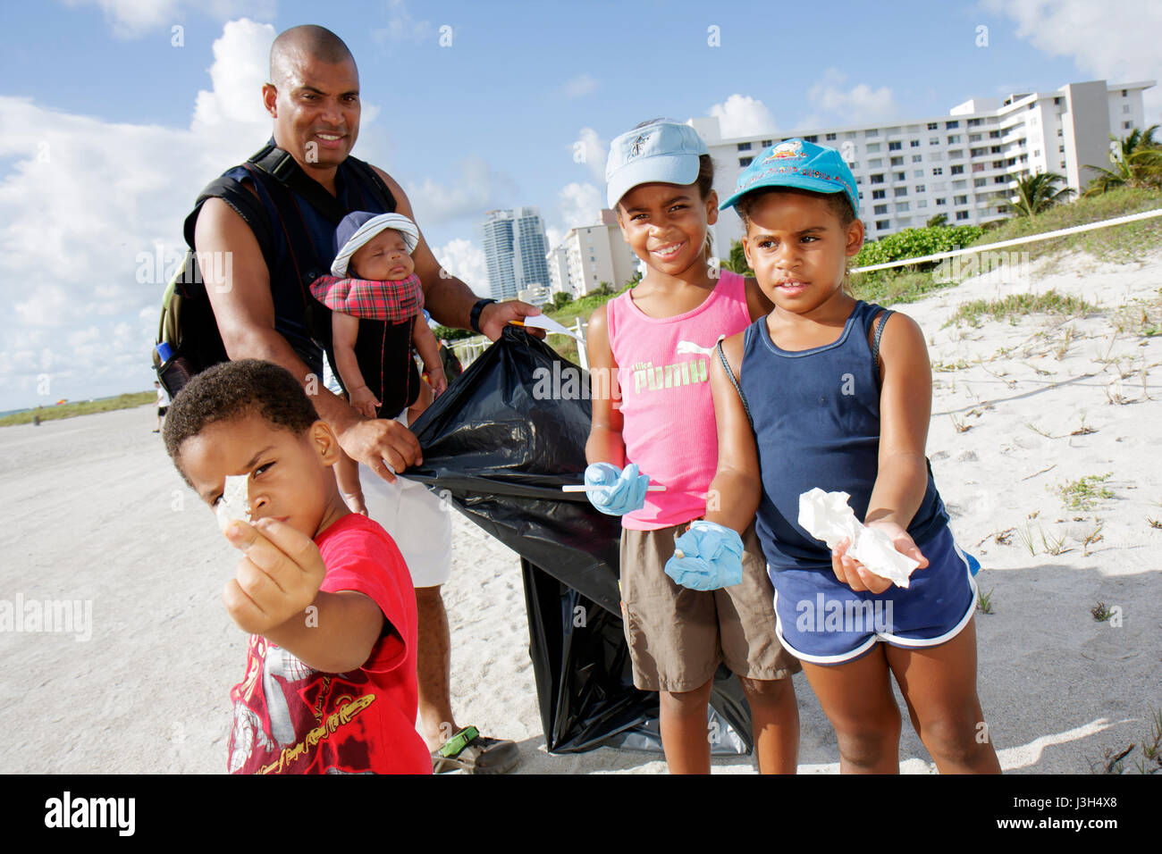 Miami Beach Florida,International Coastal Cleanup,volunteer volunteers volunteering work worker workers,working together serving help,helping Black,ma Stock Photo