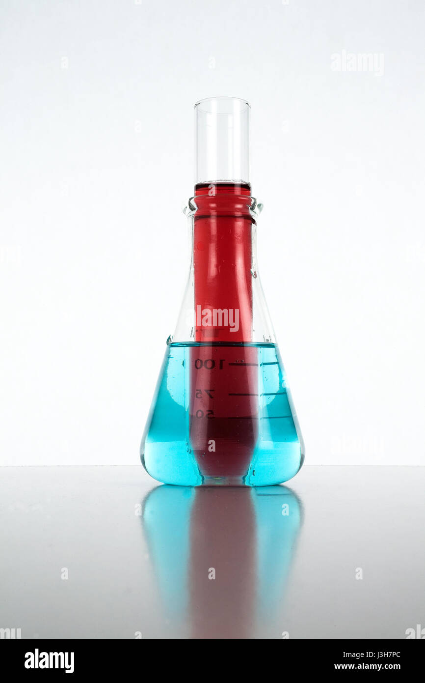 Chemistry glassware with colored liquid Stock Photo Alamy