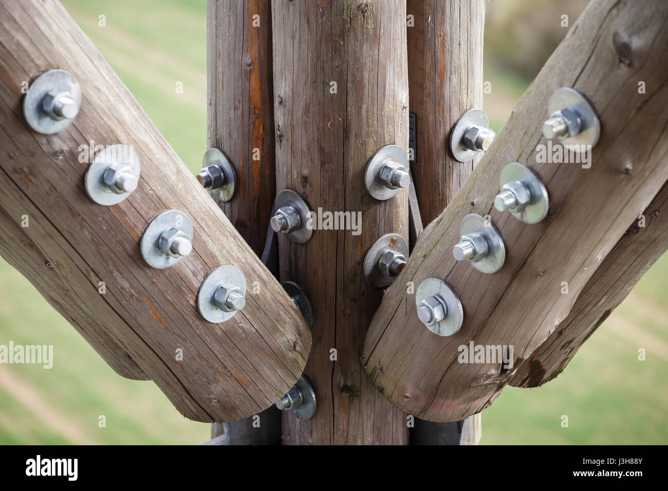 Wooden beams with screws in the structure. Assembly of wooden beams with  steel screws. Detail of the observation tower connections Stock Photo -  Alamy