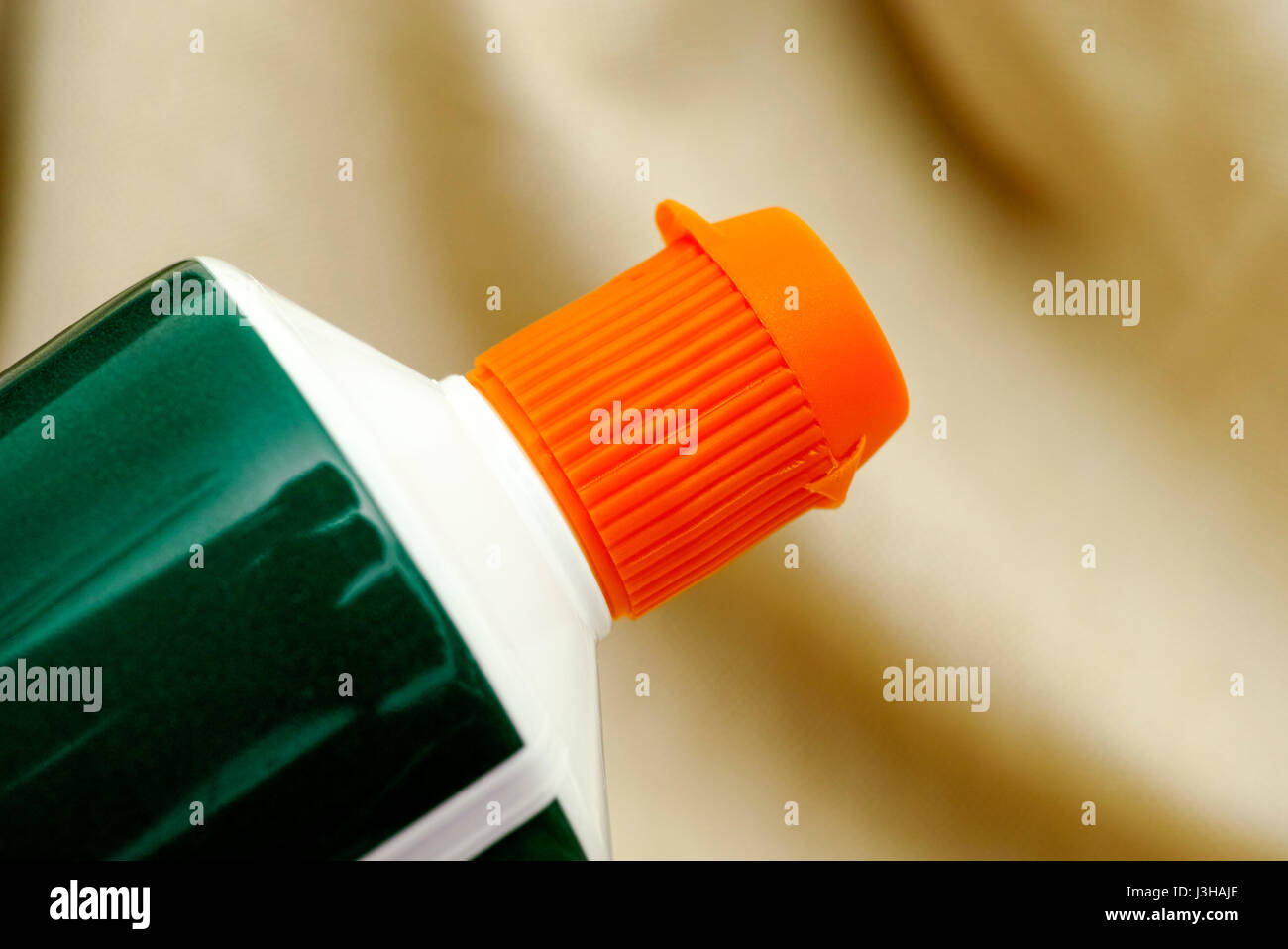 Closed orange cap of toothpaste tube. Closeup Stock Photo Alamy
