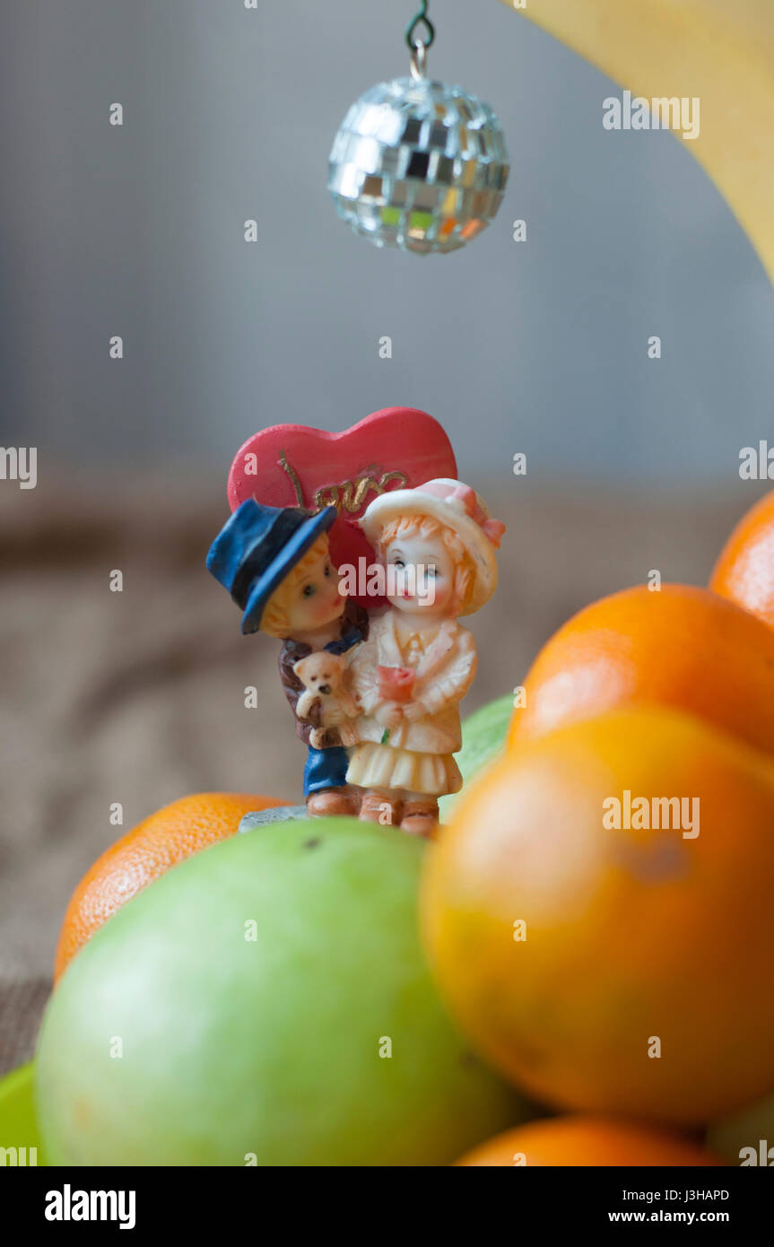 Couple in love kissing under banana Stock Photo Alamy