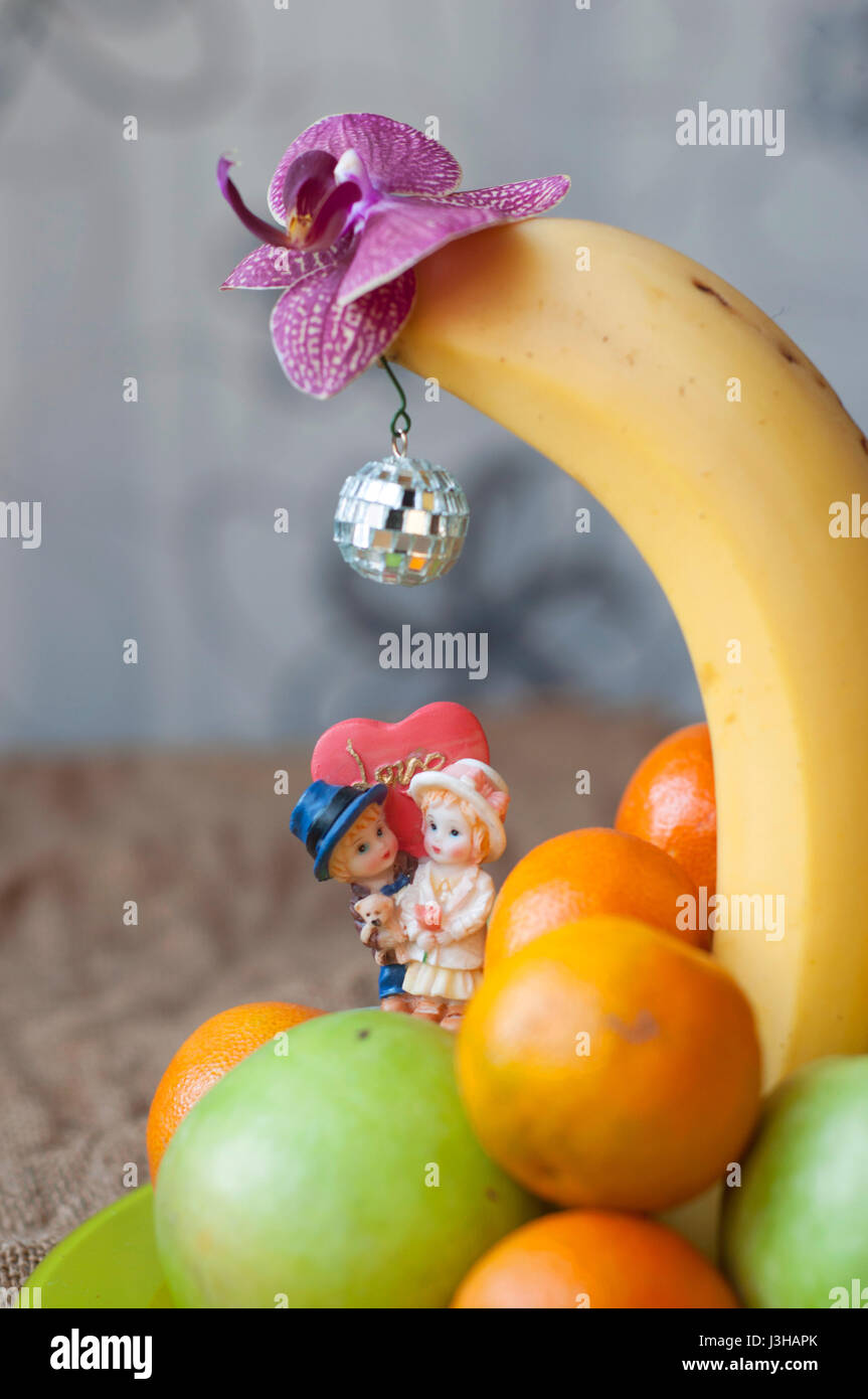 Couple in love kissing under banana Stock Photo Alamy