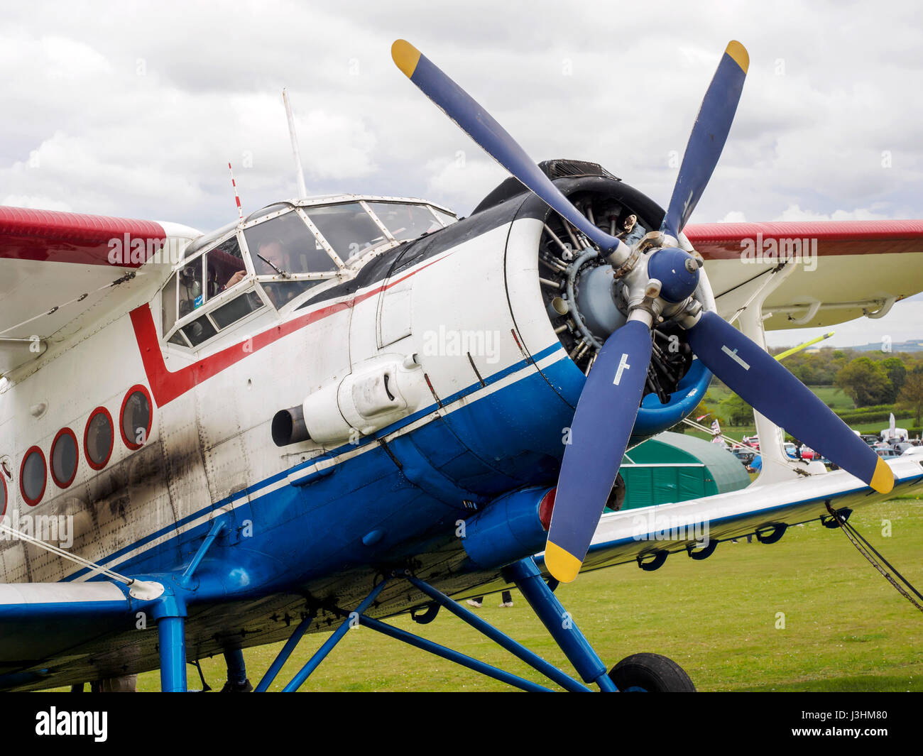 A Russian built Antonov An-2TP biplane built in 1949 for passenger and freight transport. This privcately owned example is based at Popham Airfield. Stock Photo