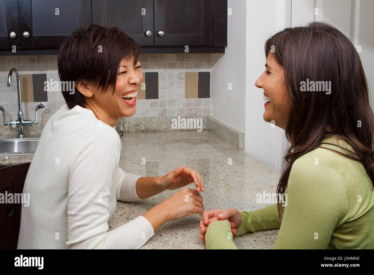 Diverse group of women talking and laughing. Stock Photo