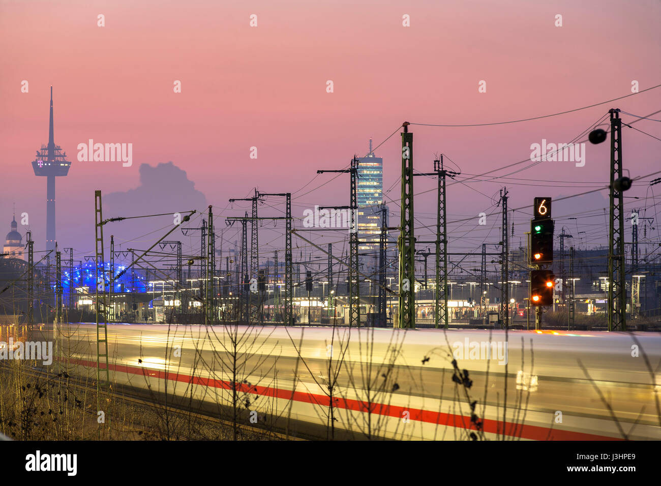 Germany, Cologne, high-speed train ICE in the town district Deutz, television tower and the highrise building KoelnTurm. Stock Photo