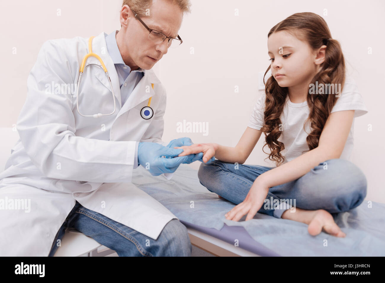 Itchy spots. Serious delicate local dermatologist looking concerned