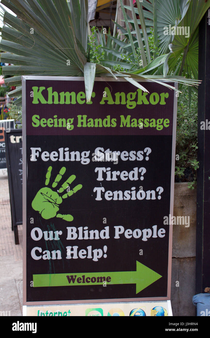 Intriguing sign for a massage parlour in Phnom Penh, Cambodia. Stock Photo