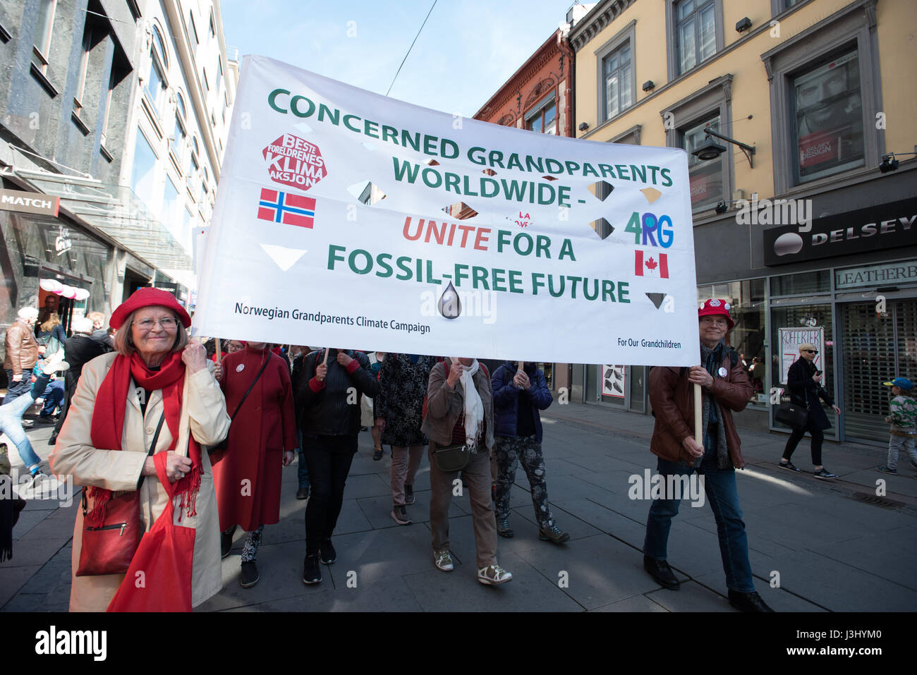 Activists carry a banner reading: 'Concerned Grandparents Worldwide Unite for a Fossil-Free Future' at the annual May Day march in Oslo, Norway, May 1, 2017. Stock Photo