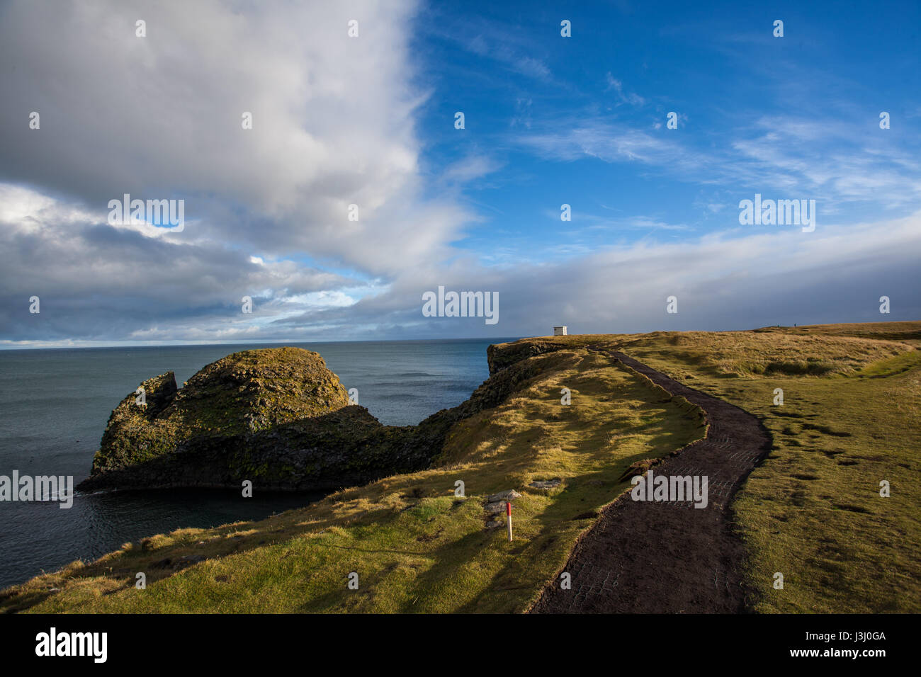 Tough nature at a cliff in Iceland. Rocky mountains and beautiful landscape. Rocks. Stock Photo