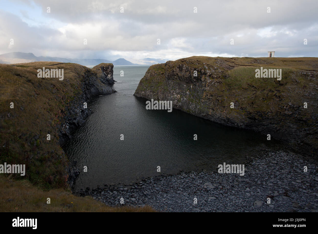 Tough nature at a cliff in Iceland. Rocky mountains and beautiful landscape. Rocks. Stock Photo