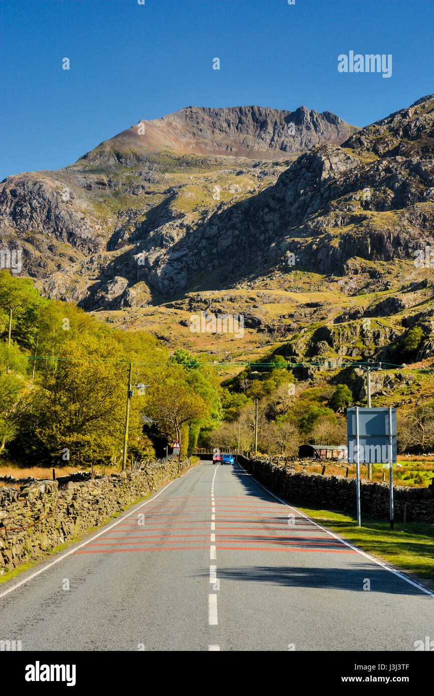 Crib Goch, the Red Comb in English, one of the peaks of the Snowdon Horseshow in the Snowdonia National Park in North Wales. Viewed from the village o Stock Photo