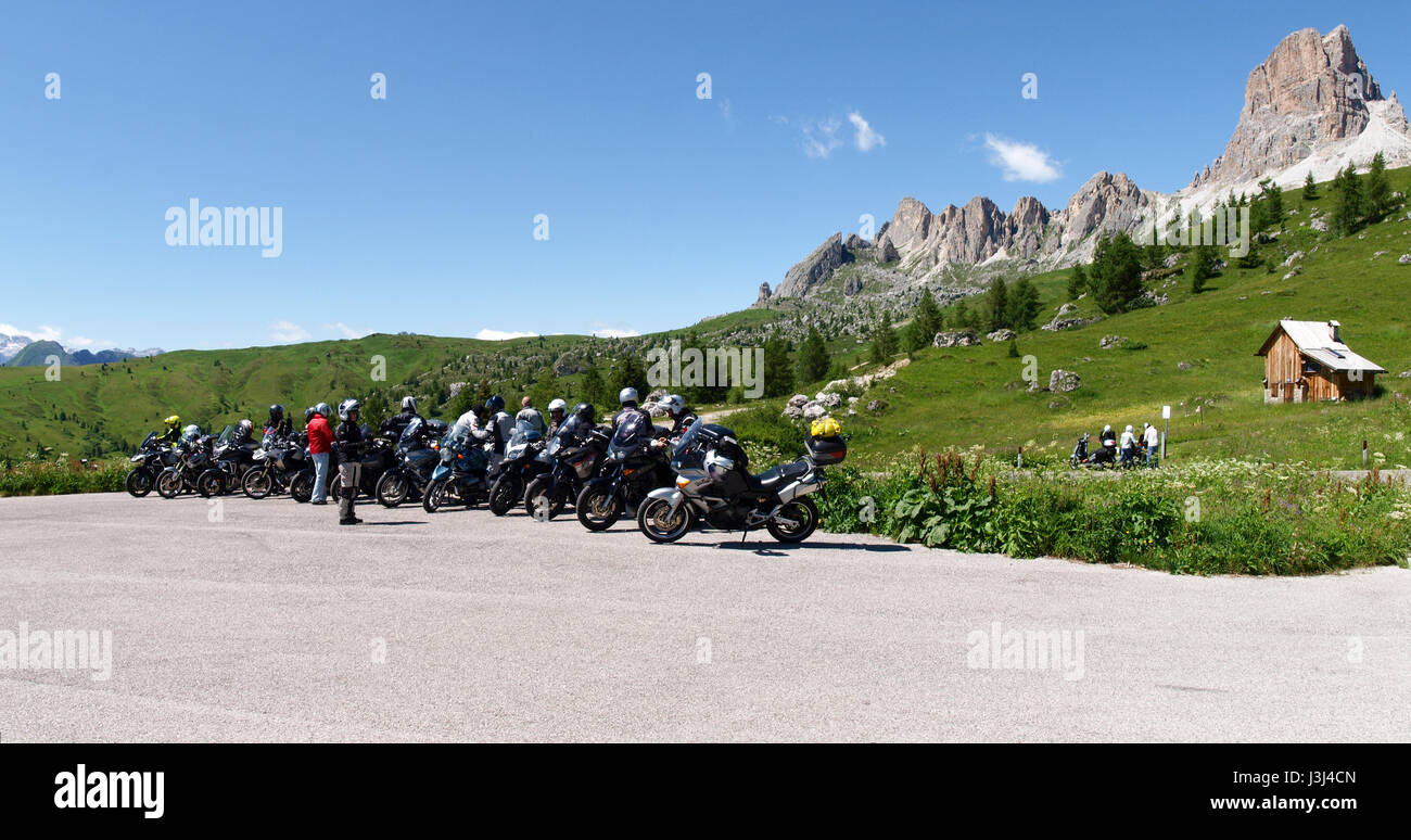 Dolomites, Italy - July 16, 2016: Motorcycles parked in the green mountain landscape Stock Photo