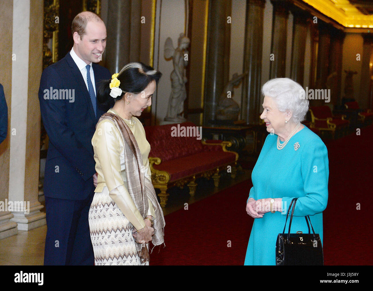 RETRANSMITTED CORRECTING LOCATION Queen Elizabeth II and the Duke of Cambridge greet Burma's de facto leader Aung San Suu Kyi ahead of a private lunch at Buckingham Palace in London. Stock Photo