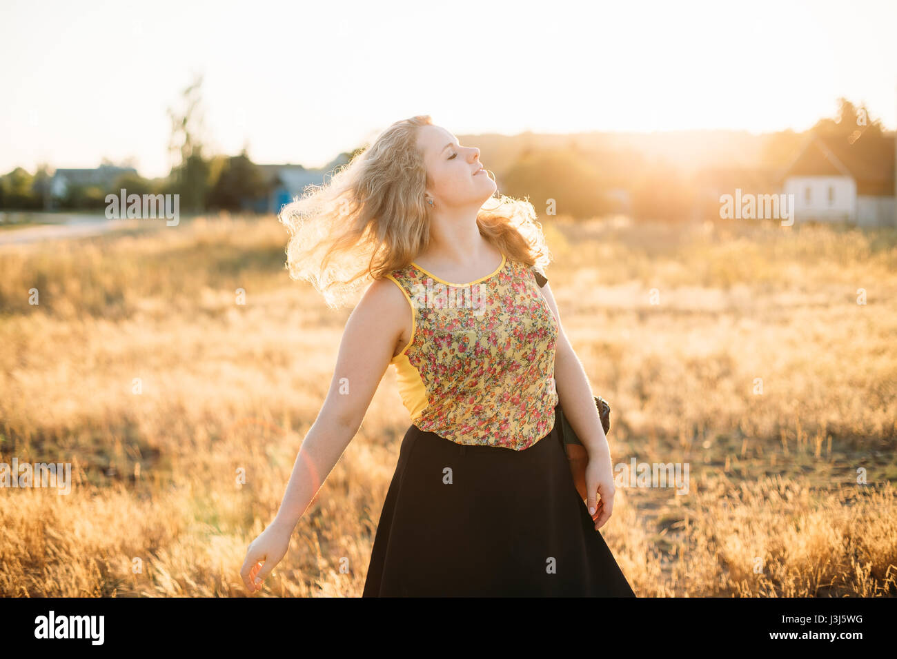 Single Young Pretty Plus Size Caucasian Happy Smiling Laughing Girl Woman Dancing In Summer Meadow. Fun Enjoy Outdoor Summer Nature. Stock Photo