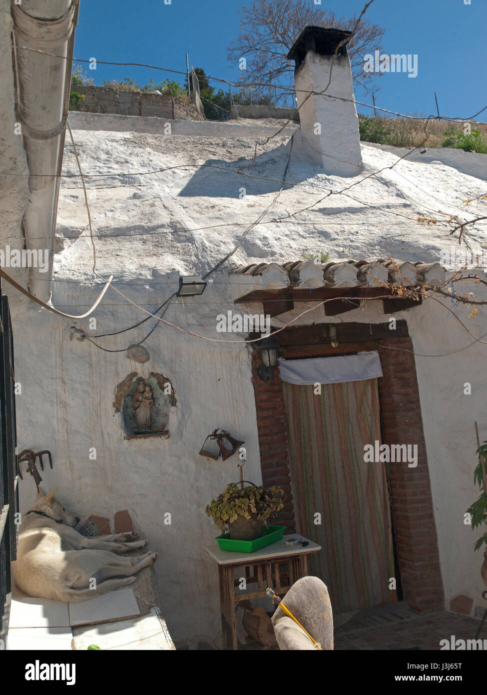 The home of a gypsy in a cave in the Sacromonte Hill, above Granada Stock Photo