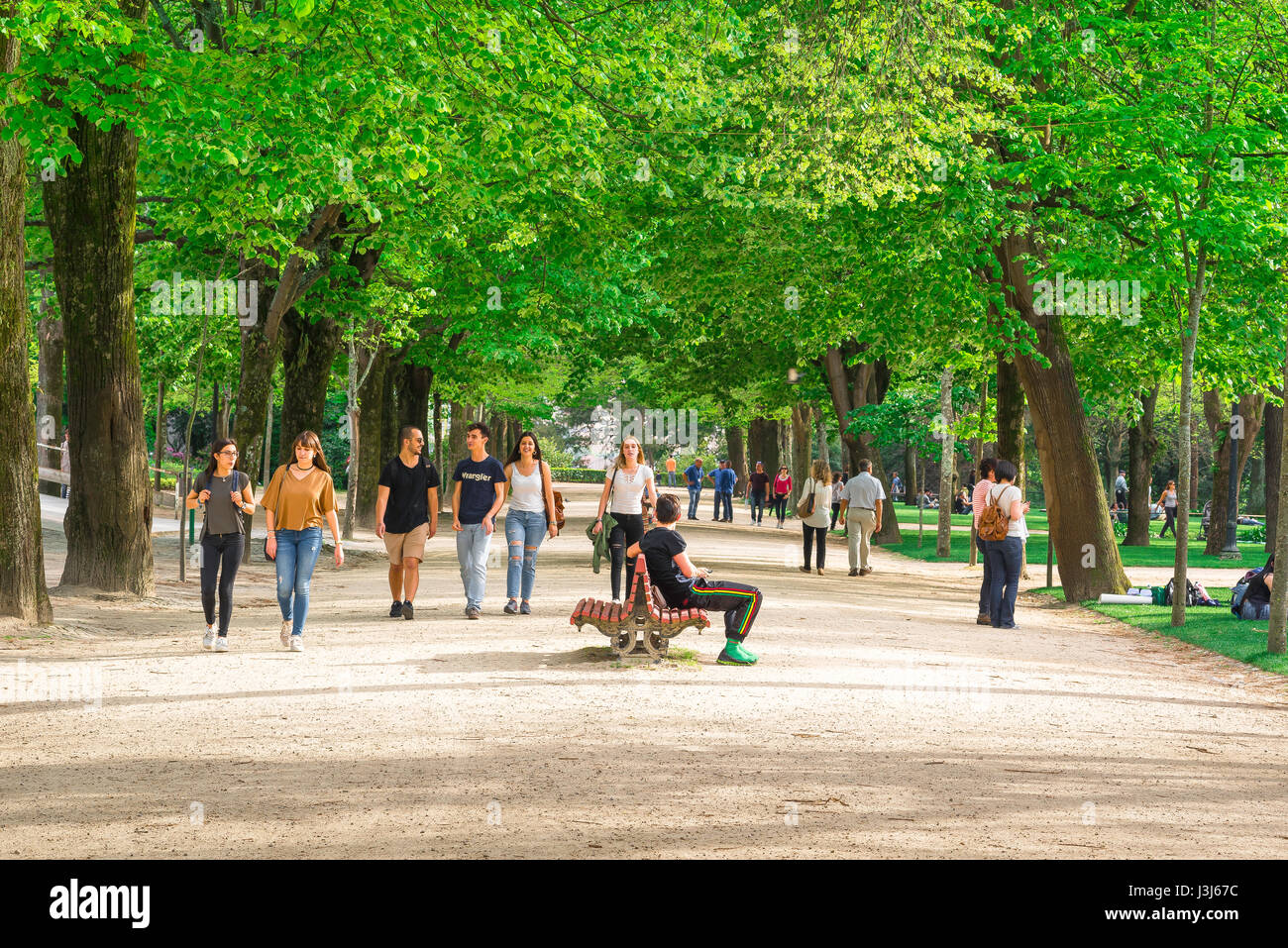 Porto Portugal park, view of young people walking and relaxing in the Jardins do Palacio de Cristal park in Porto, Portugal. Stock Photo