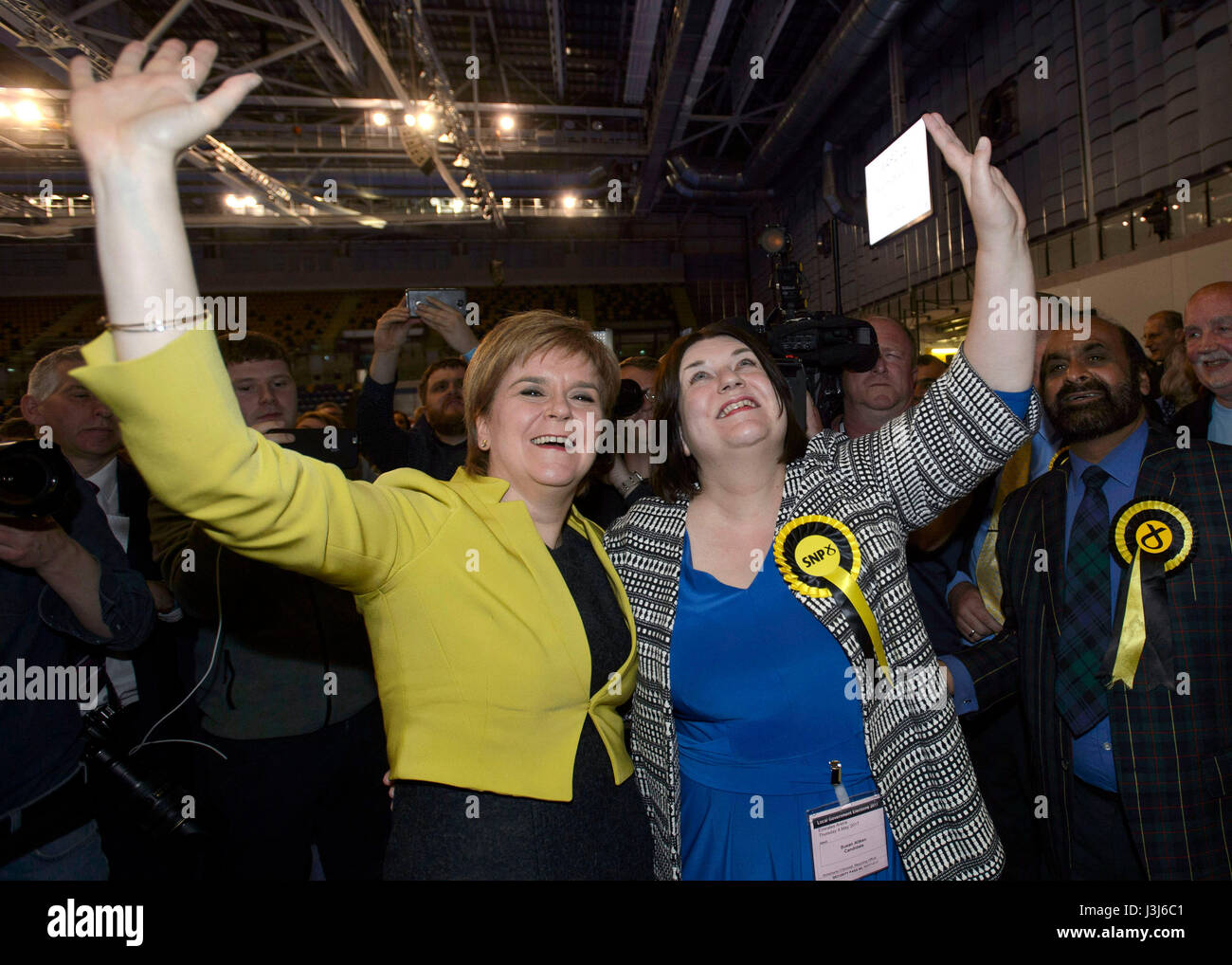 First Minister Nicola Sturgeon arrives with SNP Councillor Susan Aitken at the Emirates Stadium in Glasgow as election staff count ballot papers for the local elections. Stock Photo