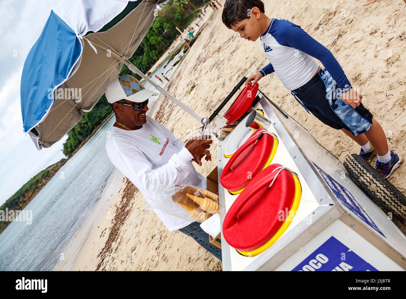 Ice cream vendor and boy, Cerro Gordo Beach, Vega Baja, Puerto Rico