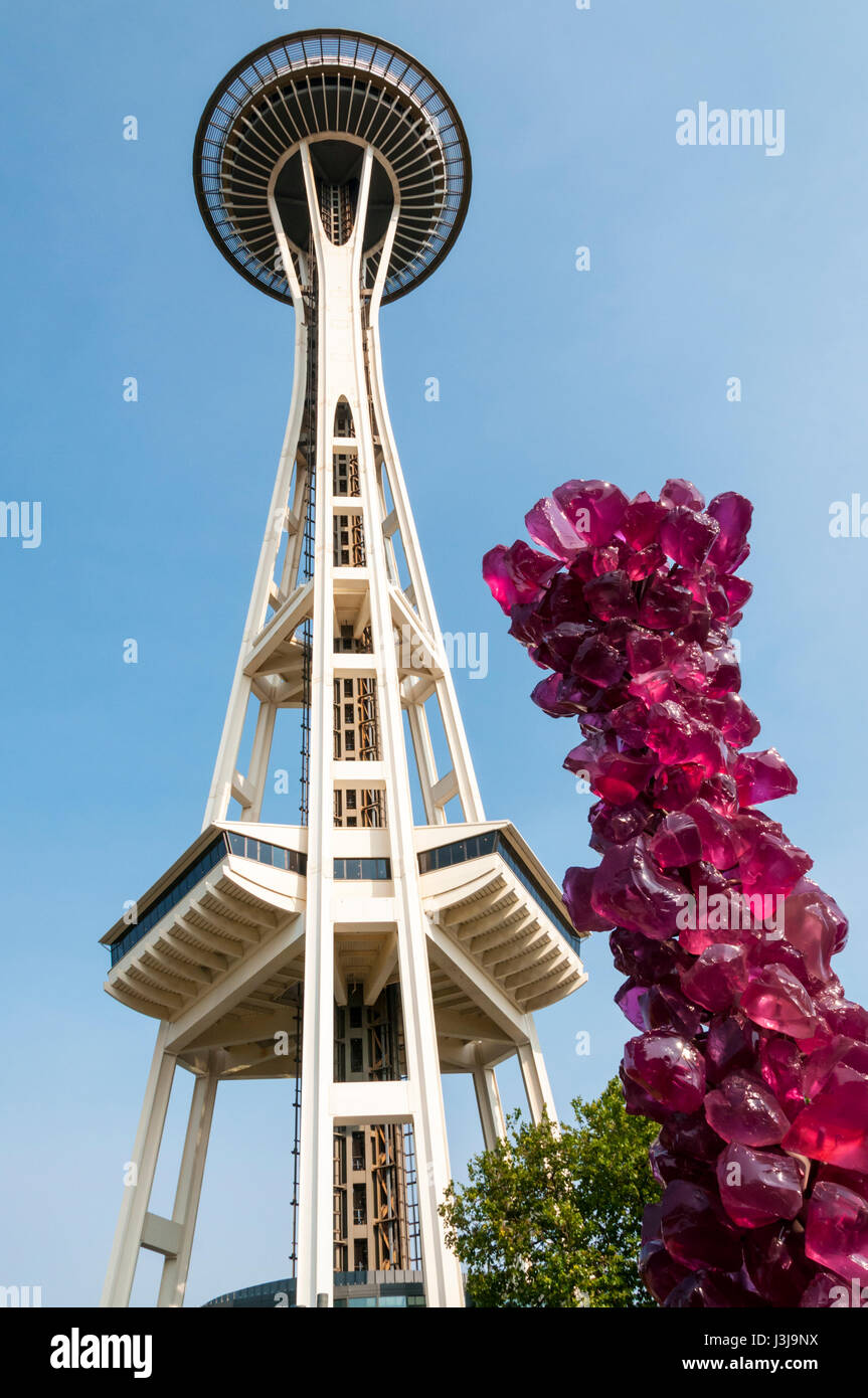 The Seattle Space Needle next to an exhibit from Chihuly Garden & Glass