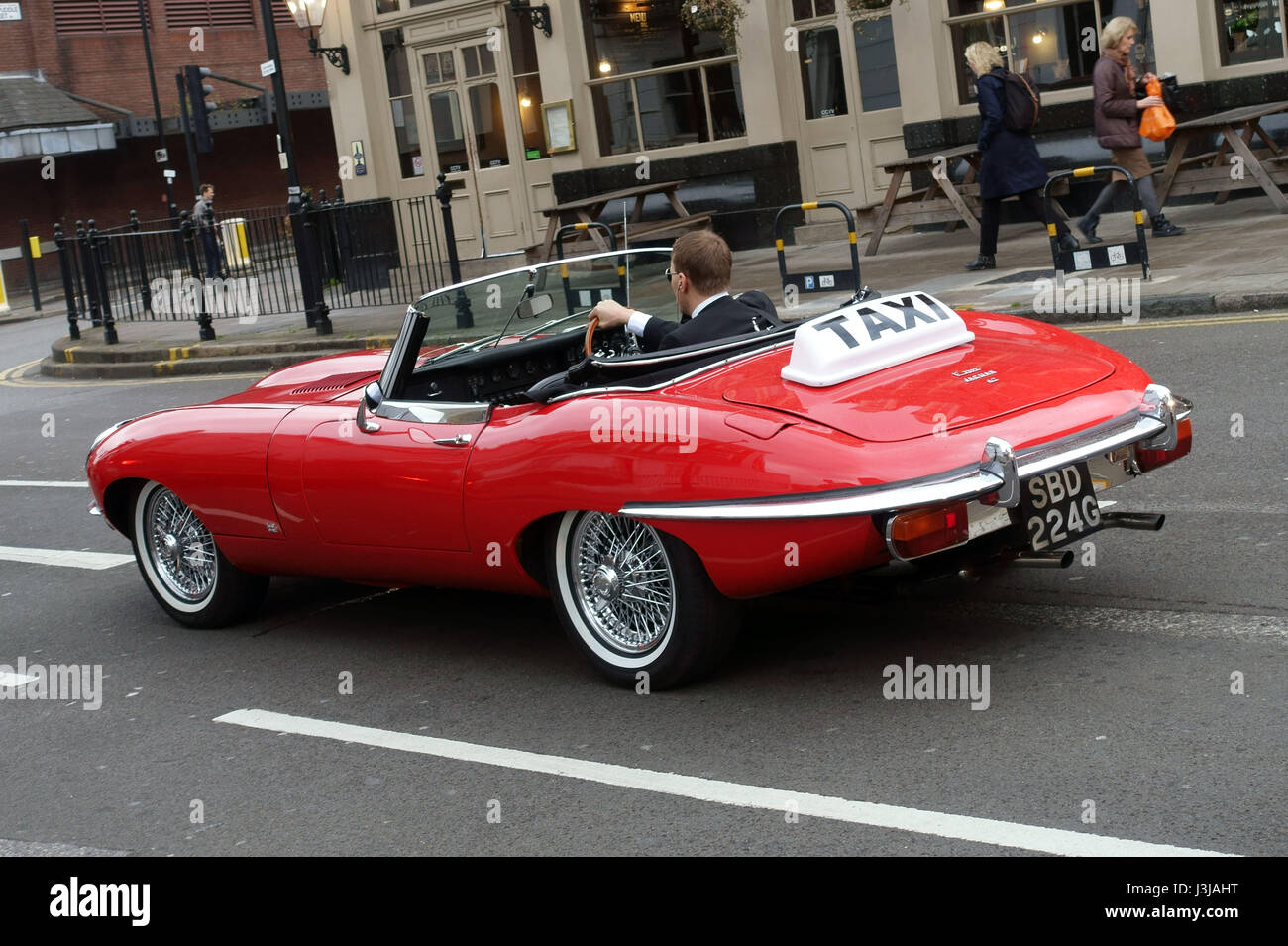 Classic 1960s E-Type Jaguar 'taxi' in London street Stock Photo