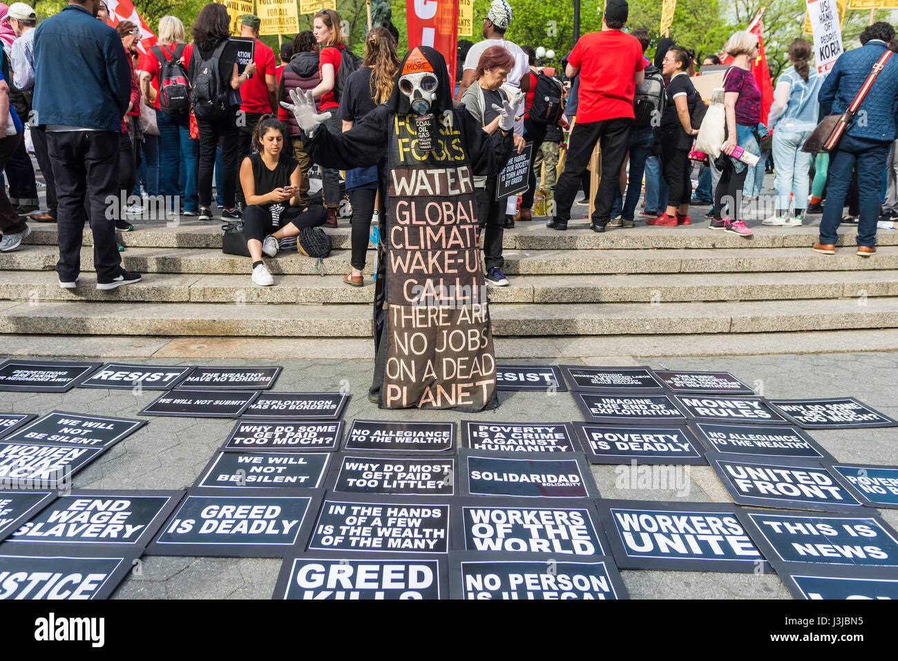 New York, NY 1 May 2017 - A Toxic Harbinger of Death, the Grim reaper, overlooks various demands and socialist issues at a May Day rally for International Workers Day in Union Square Park. ©Stacy Walsh Rosenstock/Alamy Stock Photo