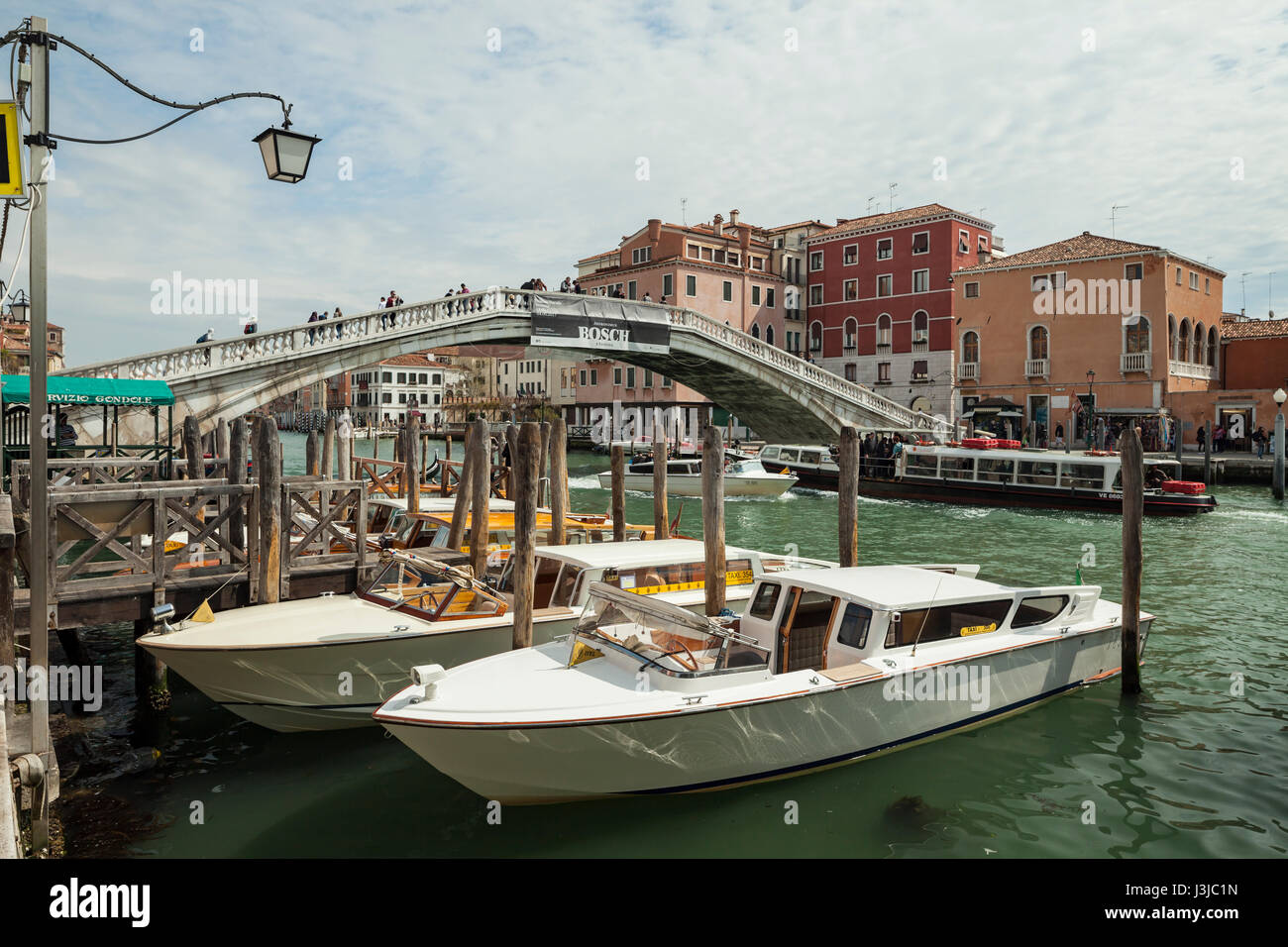 Spring day on Grand Canal in Venice. Scalzi Bridge in the background. Stock Photo
