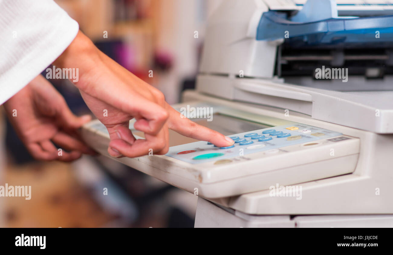 Using A Copy Machine Young Businesswoman Using Copy Machine At The Office Stock Photo - Alamy