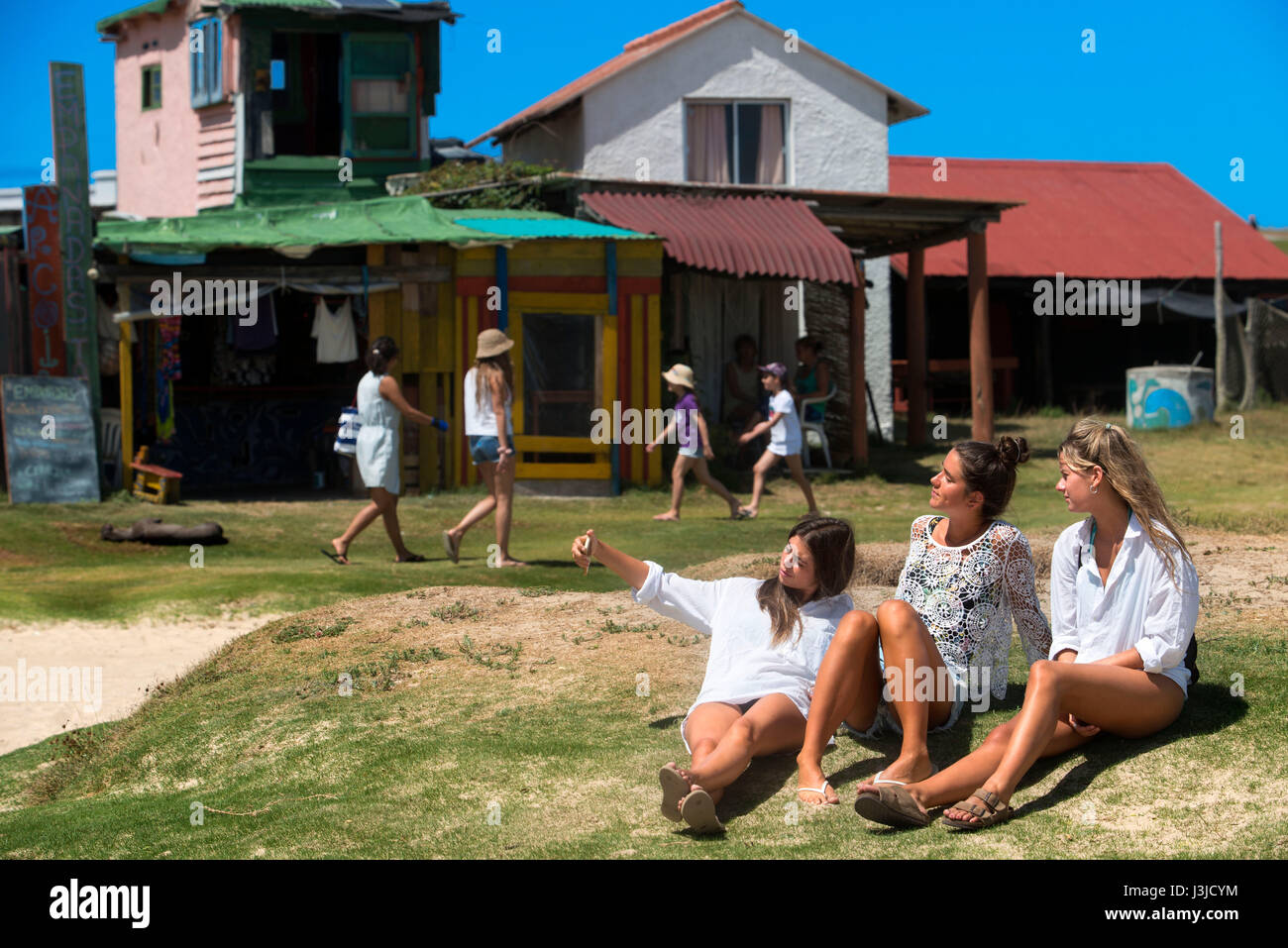 Girls and Hippie houses in Cabo Polonio, Rocha, Uruguay Stock Photo