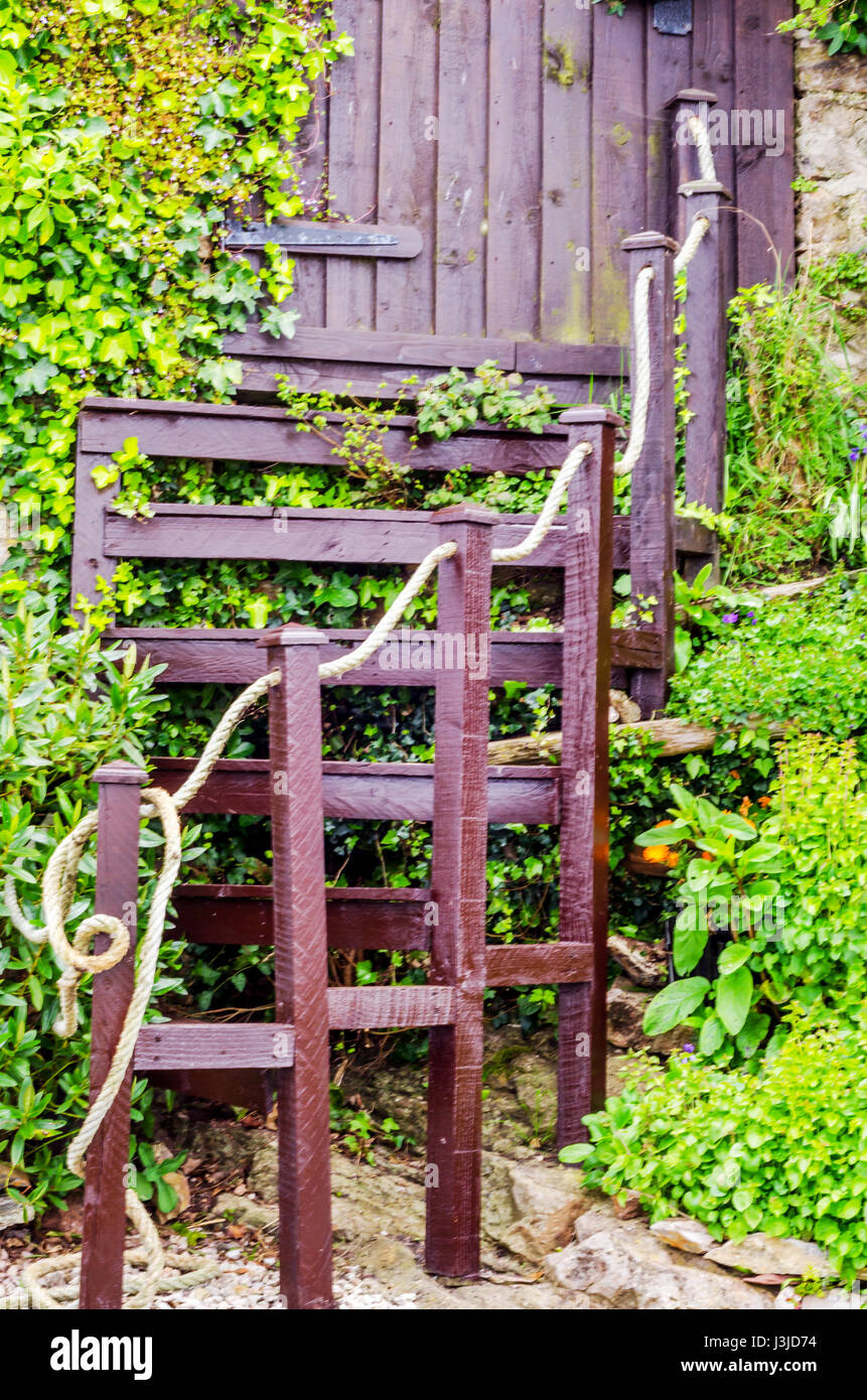 Wooden entrance to the building, wooden stairs, wooden railing with ...