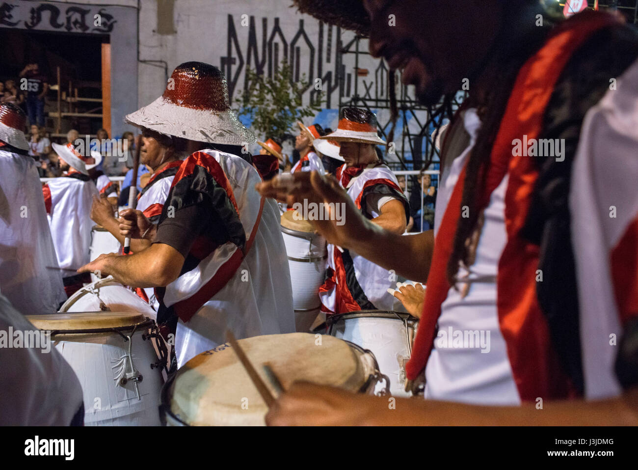 Traditional Murgas and samba schools during the Llamadas (the calling) procession that officially starts the carnival in Montevideo, Uruguay. Is the l Stock Photo