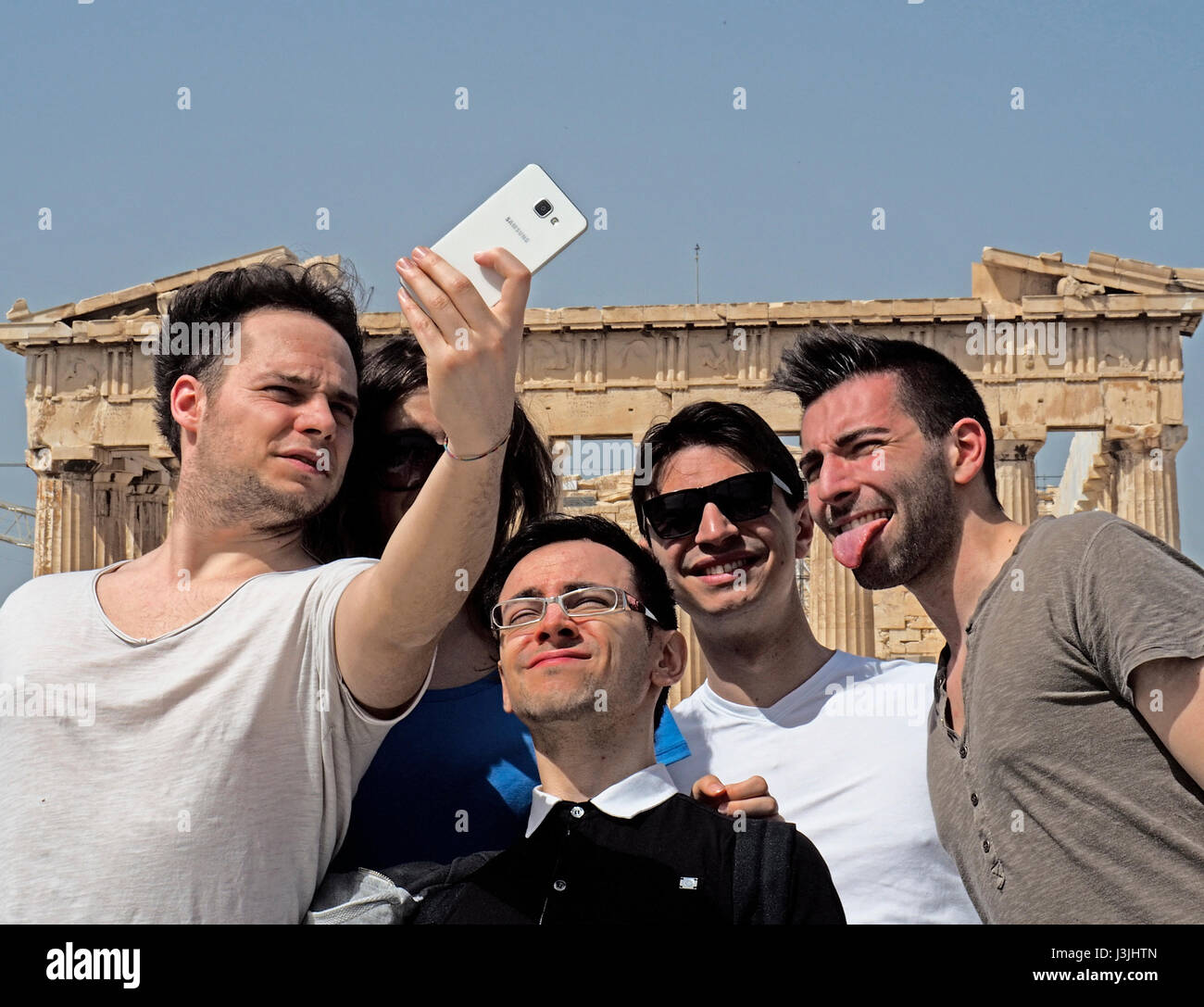 Tourists doing selfies at the Parthenon in Athens. Stock Photo