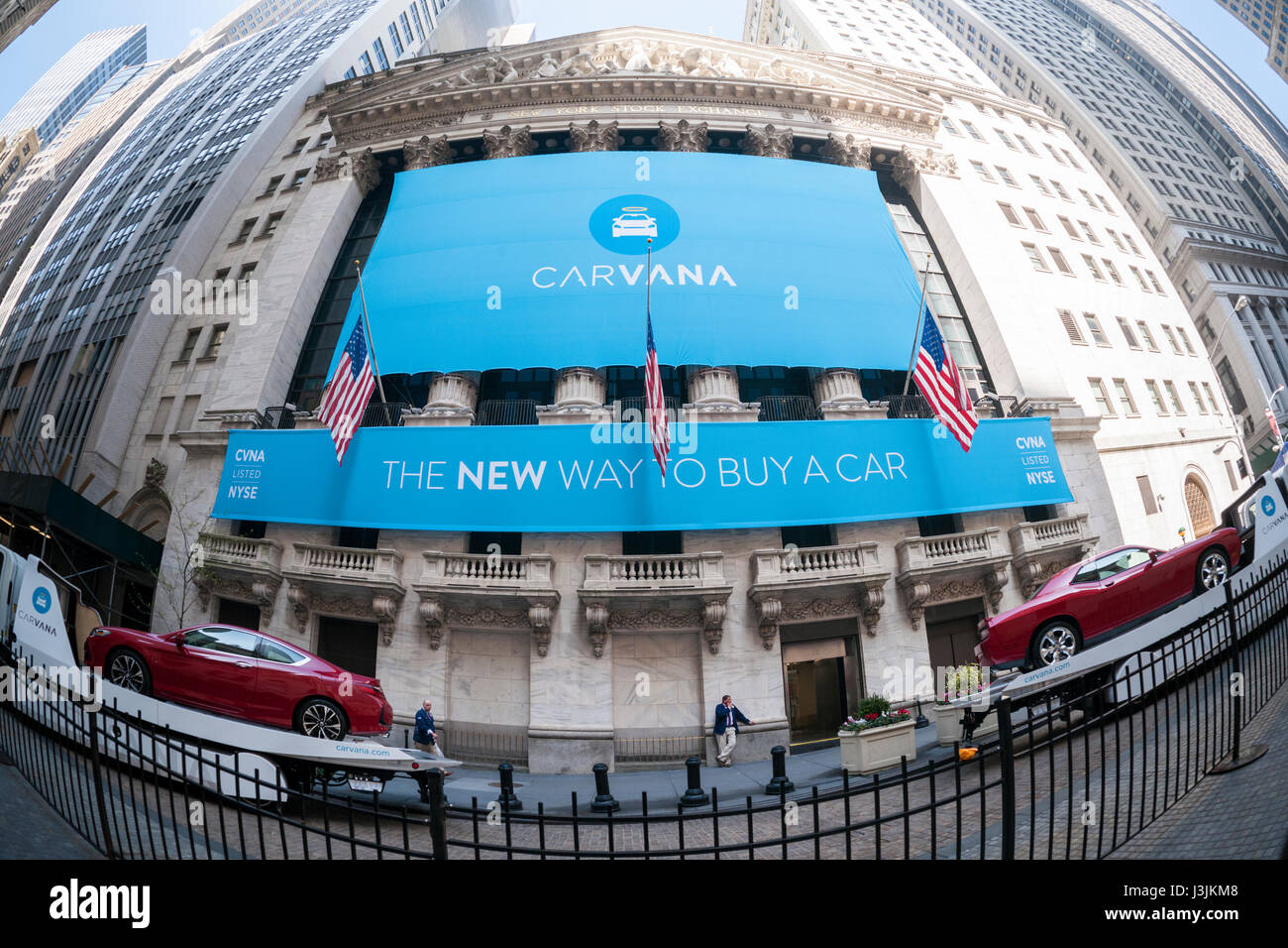 The New York Stock Exchange is decorated for the initial public offering of the car vending machine company Carvana on Friday, April 28, 2017. The Texas-based company sells used cars online where purchasers have the option of picking up their vehicle at a huge vending machine. Carvana also offers financing after which it sells the loans to a third-party.  (© Richard B. Levine) Stock Photo