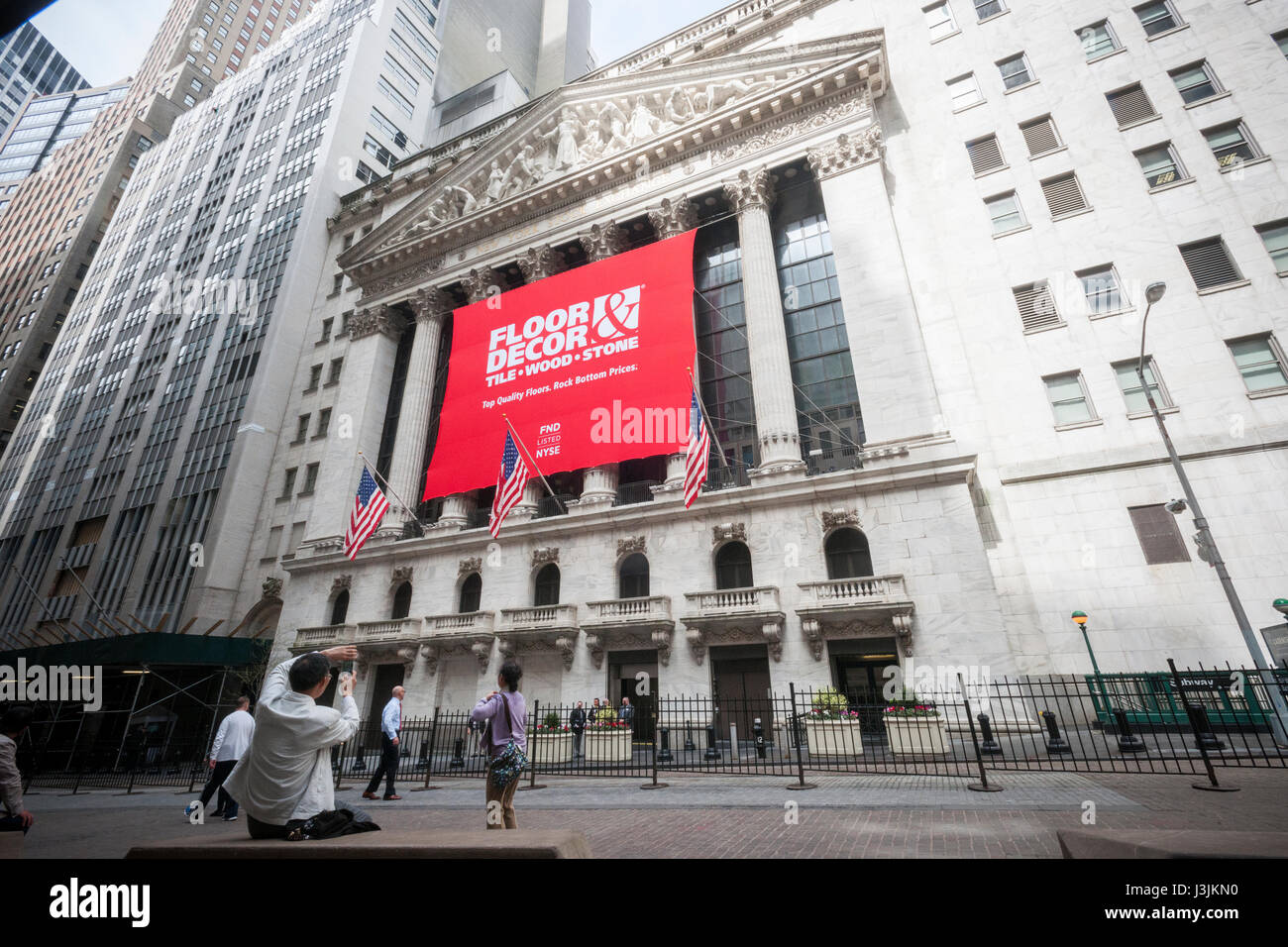 The facade of the New York Stock Exchange is decorated for the first day of  trading for Floor & Decor Holding's initial public offering on Thursday, April  27, 2017. Floor & Decor