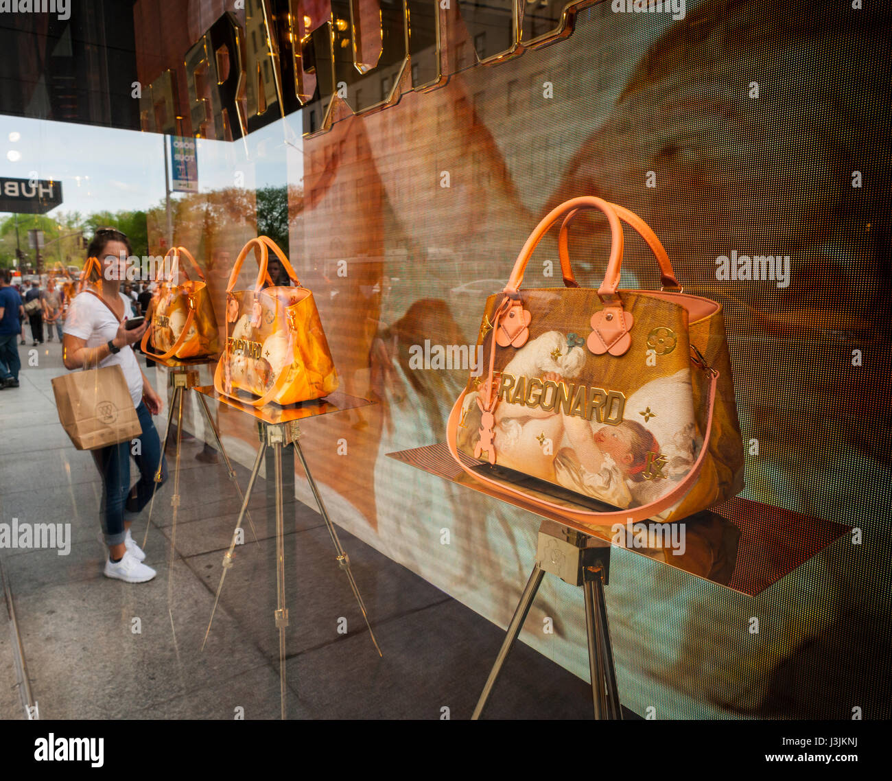 Jeff Koons limited edition handbags are seen in the window of Louis Vuitton  on Fifth Avenue in New York on Saturday, April 29, 2017, The handbags, in  appropriated image style, feature portrayals