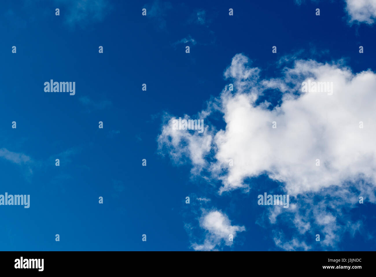 White clouds on a blue sky. Stock Photo
