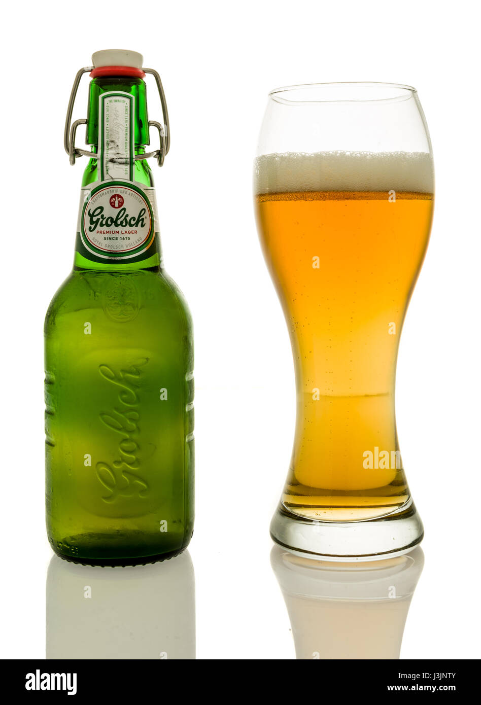 Winneconne, WI - 28 April 2017: A bottle of Grolsch premium lager beer with a glass on an isolated background. Stock Photo