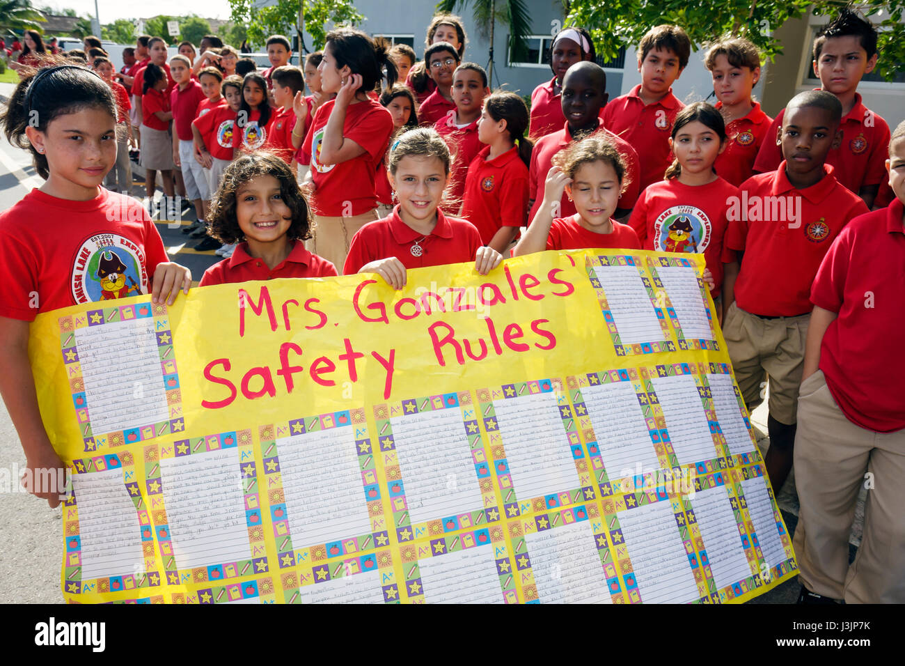 Miami Florida,Spanish Lake Elementary School,International Walk to School Day,student students pupil safety poster contest,parade,Hispanic girl girls, Stock Photo